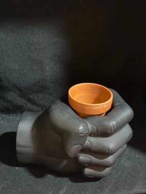 Weighted fist hand desk caddy planter with magnetic section
